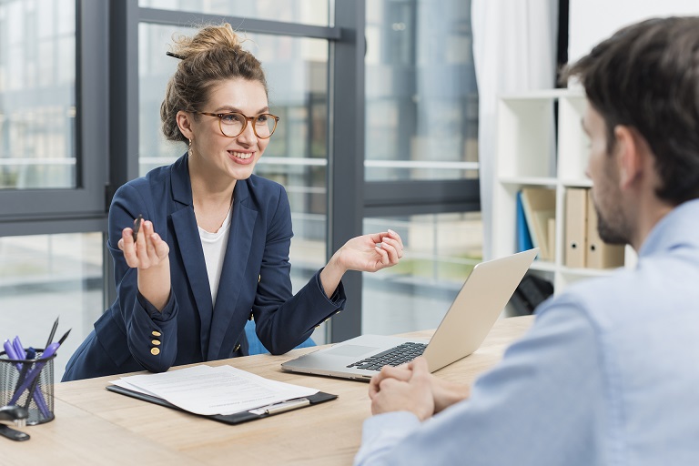 side-view-woman-holding-job-interview-with-man